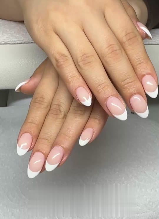 Almond-shaped nails with a classic white French tip
